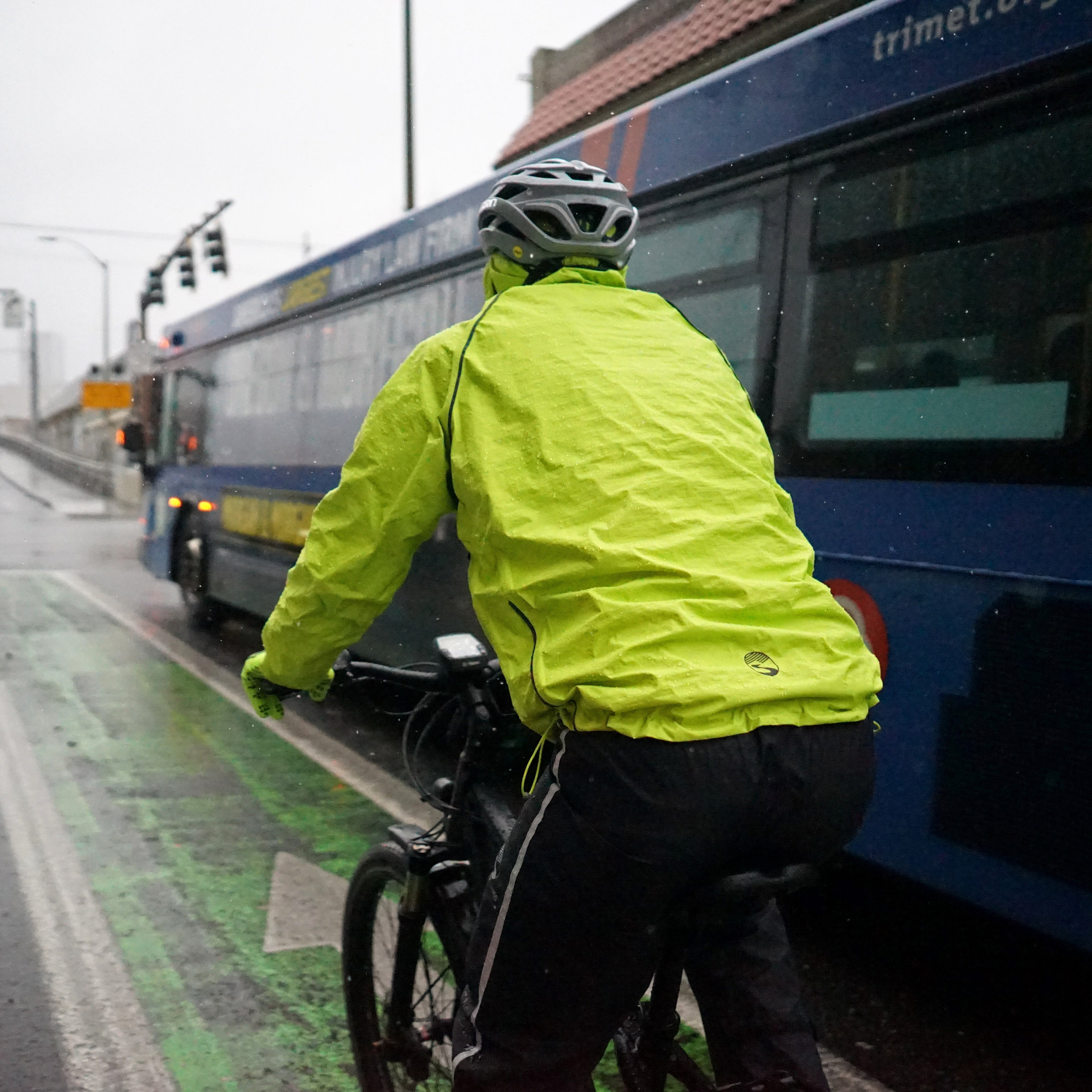 Showers Pass Syncline Jacket on a bike commuter in the rain